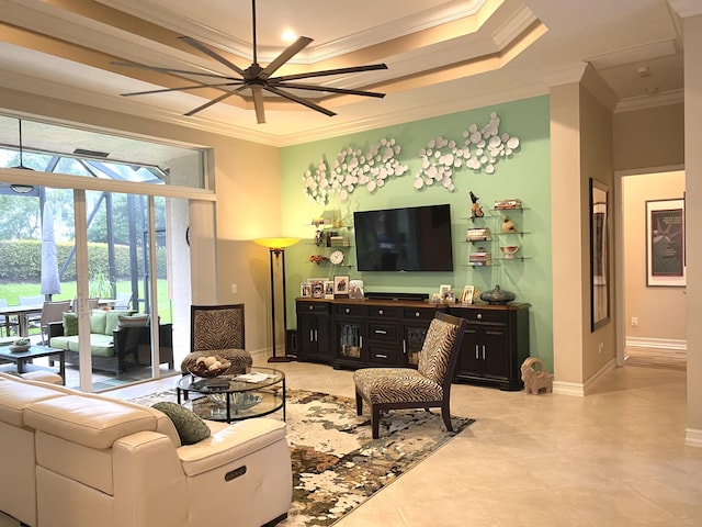 living room with crown molding, ceiling fan, and light tile patterned floors