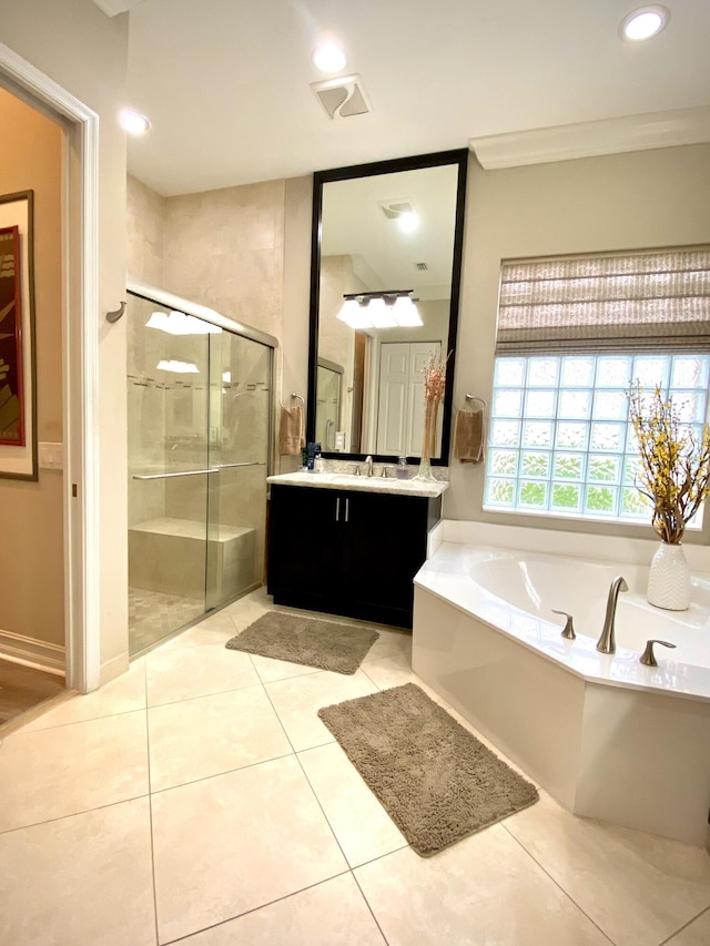 bathroom with tile patterned flooring, vanity, crown molding, and shower with separate bathtub