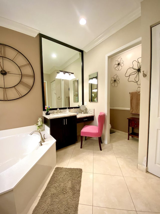 bathroom featuring a tub to relax in, vanity, and ornamental molding