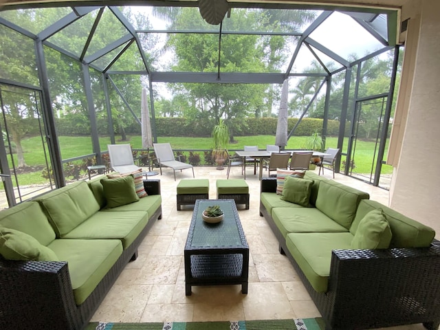 view of patio / terrace featuring an outdoor living space and glass enclosure