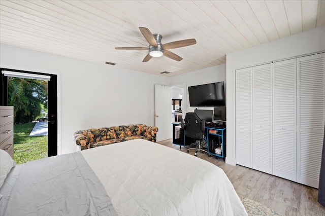 bedroom with access to exterior, ceiling fan, a closet, wooden ceiling, and light hardwood / wood-style floors