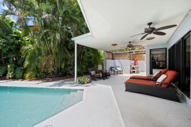 view of pool featuring ceiling fan and a patio area