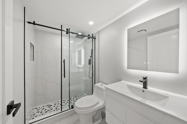 bathroom with vanity, toilet, and an enclosed shower