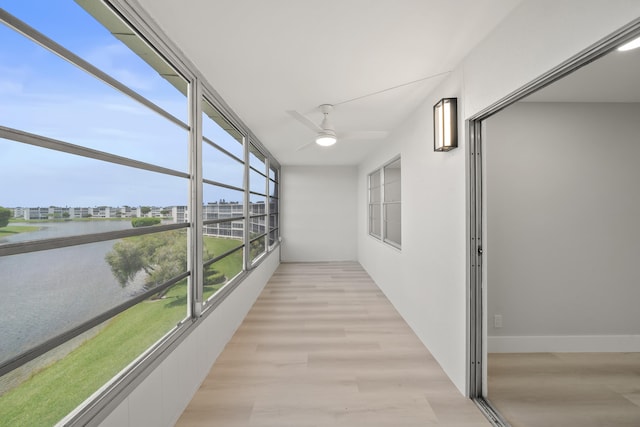 interior space with ceiling fan