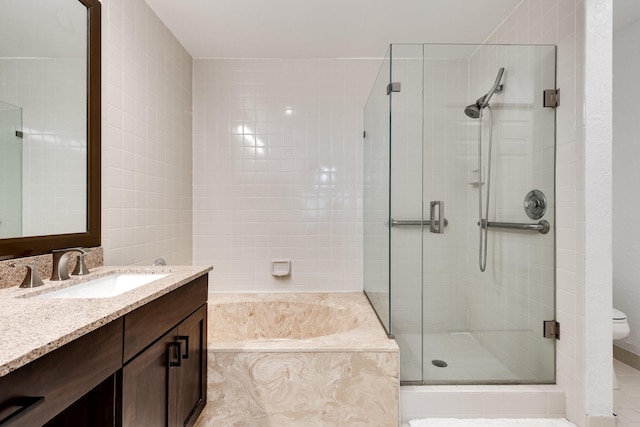 full bathroom featuring independent shower and bath, vanity, toilet, and tile patterned floors