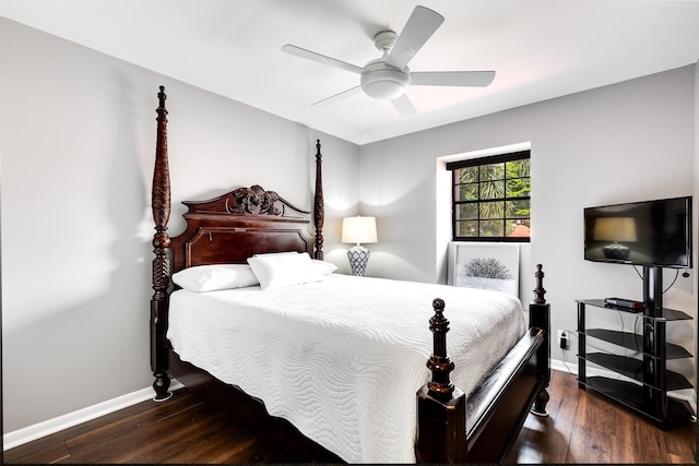 bedroom with dark hardwood / wood-style floors and ceiling fan