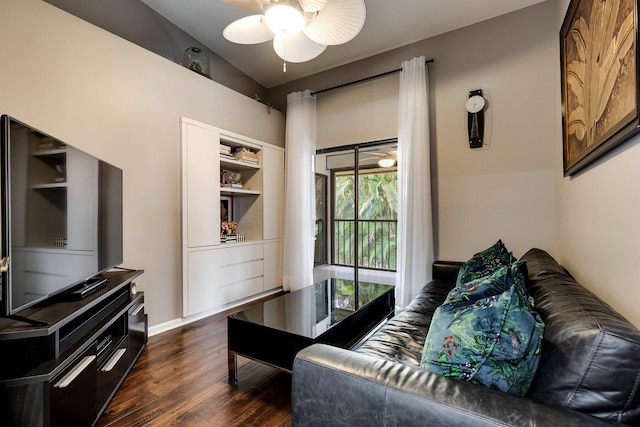 living room with dark hardwood / wood-style flooring and ceiling fan