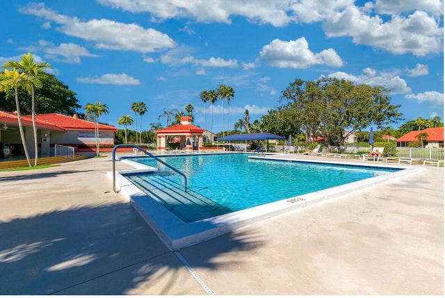 view of swimming pool featuring a gazebo and a patio