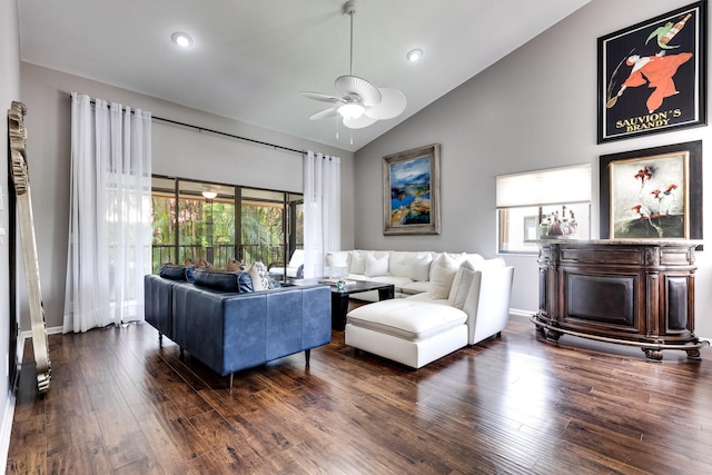 living room with ceiling fan, dark hardwood / wood-style floors, and high vaulted ceiling