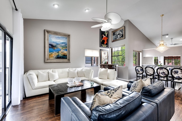 living room featuring dark hardwood / wood-style floors, ceiling fan, and high vaulted ceiling