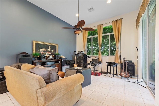 tiled living room with lofted ceiling and ceiling fan