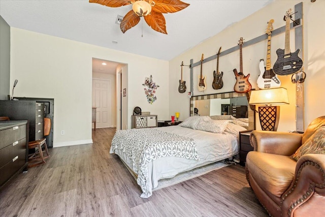 bedroom featuring wood-type flooring and ceiling fan