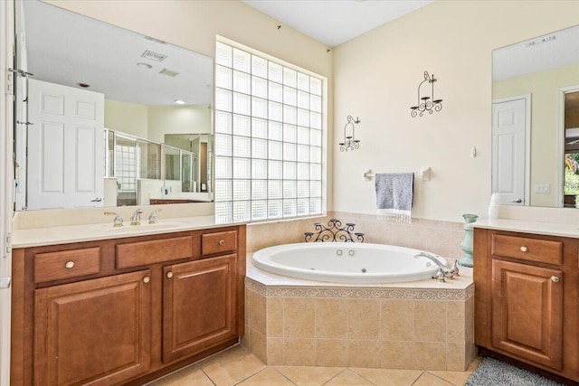 bathroom featuring tile patterned flooring, vanity, and independent shower and bath