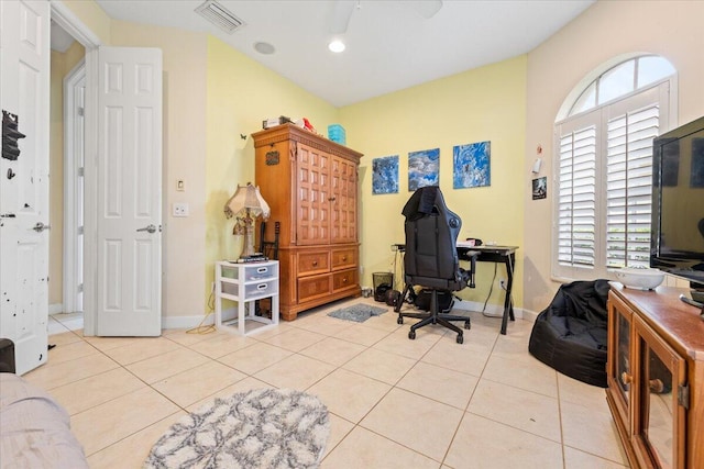 tiled office space with ceiling fan