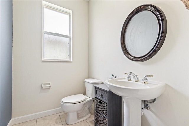 bathroom featuring tile patterned flooring and toilet