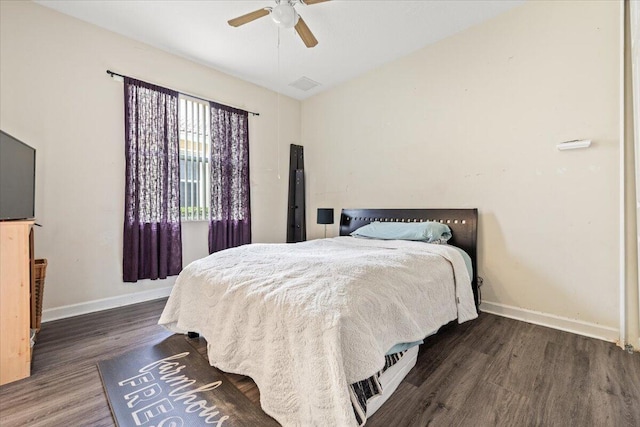 bedroom with lofted ceiling, ceiling fan, and dark hardwood / wood-style flooring