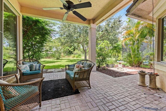 view of patio / terrace featuring an outdoor living space and ceiling fan