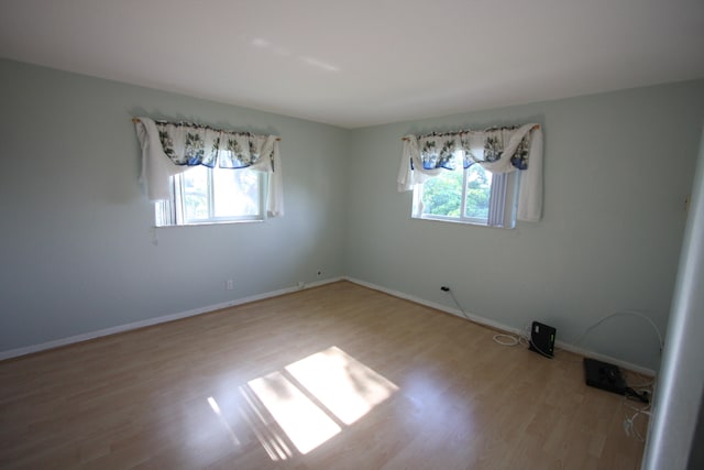 empty room featuring hardwood / wood-style floors