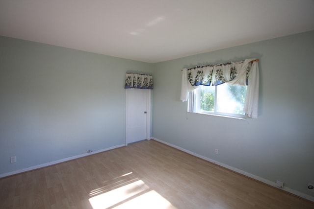 unfurnished room featuring light hardwood / wood-style flooring