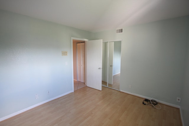 spare room featuring light wood-type flooring