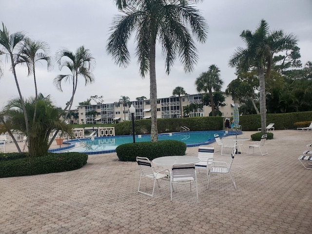 view of swimming pool featuring a patio