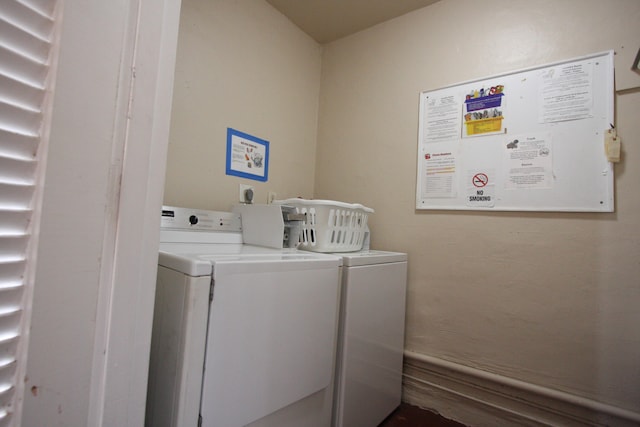 laundry room featuring washer and clothes dryer