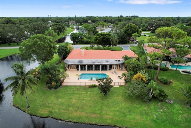 birds eye view of property with a water view