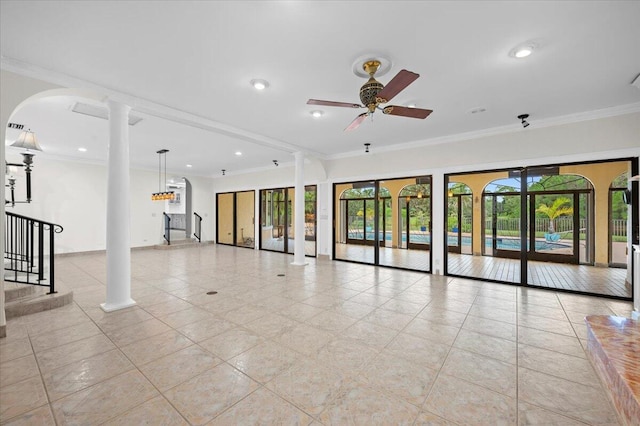 interior space with ceiling fan, light tile patterned flooring, crown molding, and decorative columns