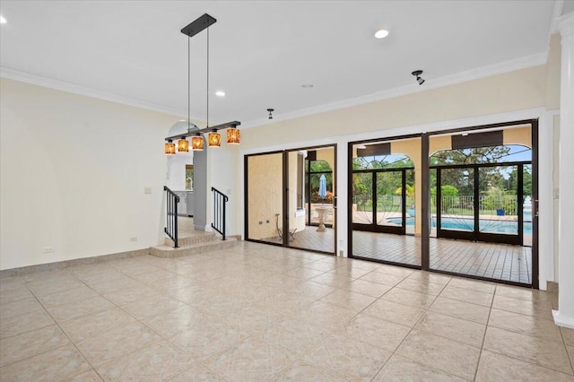 unfurnished living room with built in shelves, plenty of natural light, ornamental molding, and ceiling fan