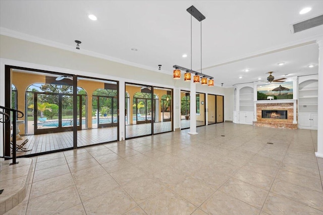 unfurnished living room featuring light tile patterned flooring, crown molding, ceiling fan, and built in shelves