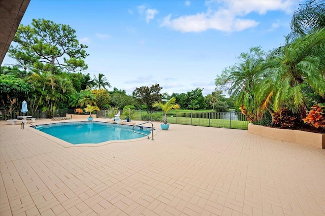 view of swimming pool featuring a patio area