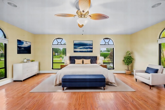 bedroom featuring ceiling fan and light hardwood / wood-style flooring