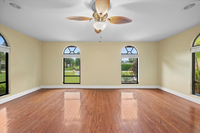 spare room featuring ceiling fan and light wood-type flooring