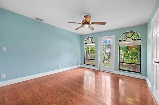 empty room featuring ceiling fan and light wood-type flooring