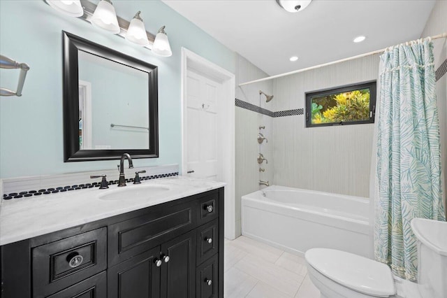 full bathroom with tile patterned flooring, shower / bath combination with curtain, vanity, and toilet