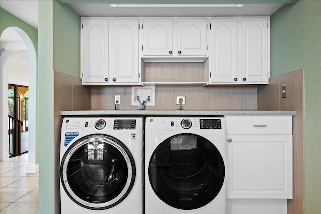 washroom featuring separate washer and dryer and light tile patterned floors