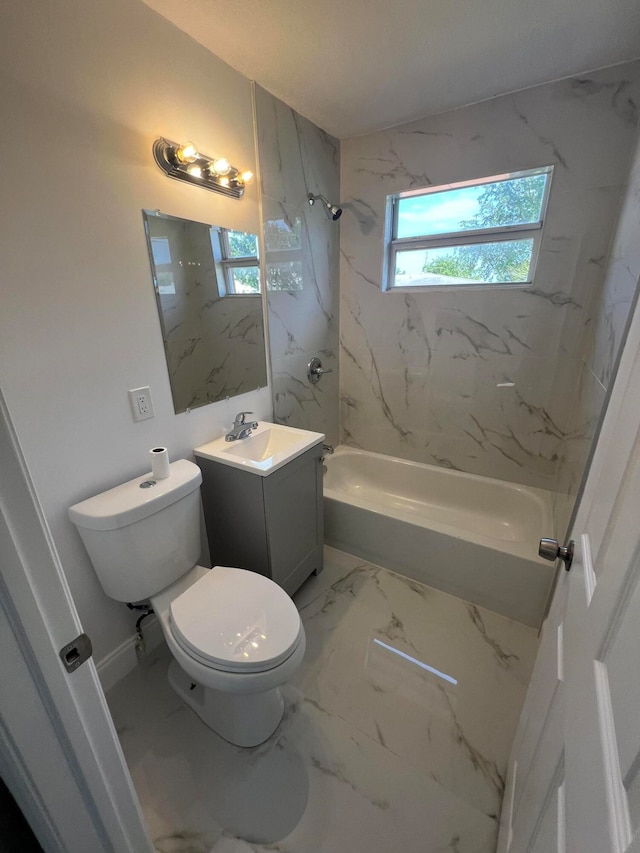 full bathroom with tiled shower / bath, toilet, and vanity