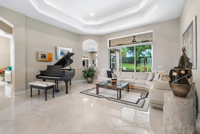 living room featuring a tray ceiling