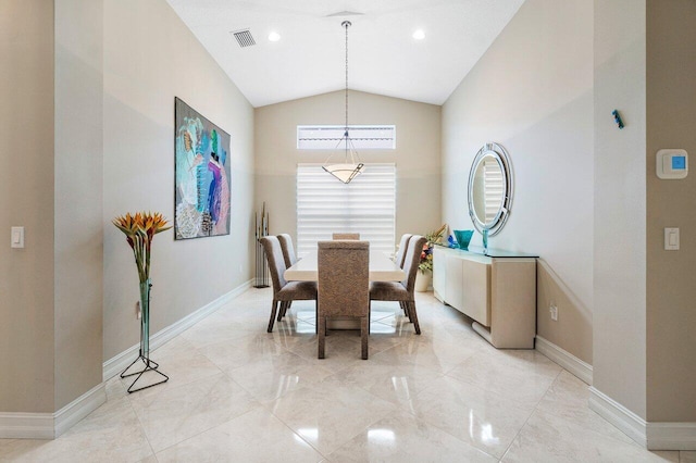 dining room featuring lofted ceiling