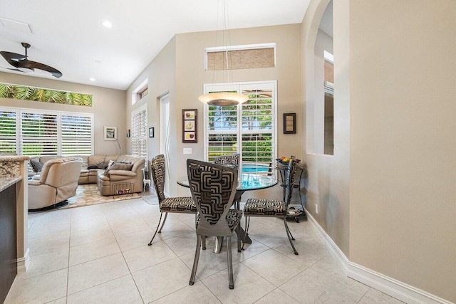 tiled dining room with ceiling fan