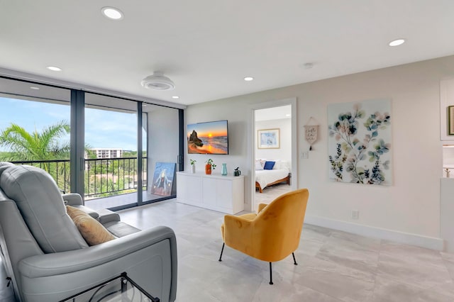 living room with a wall of windows