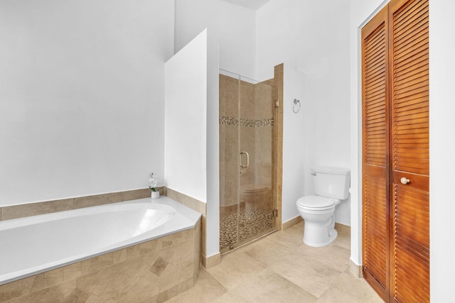 bathroom featuring shower with separate bathtub and toilet