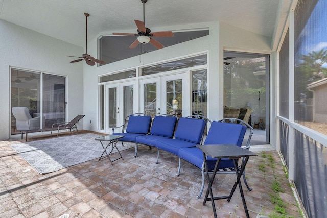 sunroom / solarium with french doors, ceiling fan, and vaulted ceiling