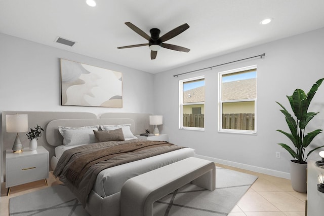 tiled bedroom with ceiling fan