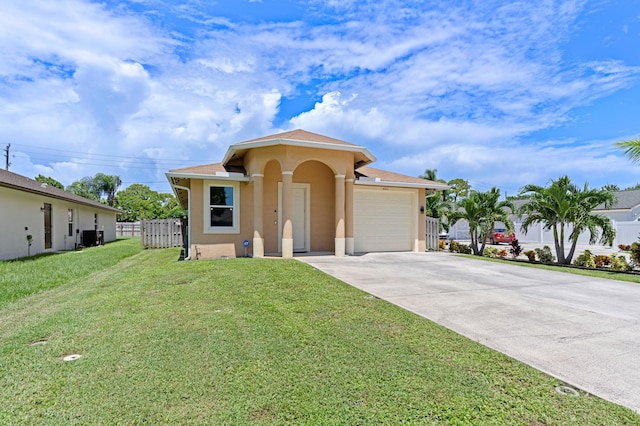 view of front facade with cooling unit, a garage, and a front lawn