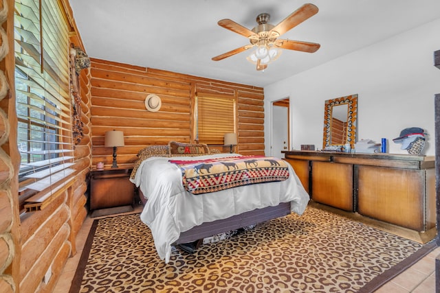 bedroom featuring ceiling fan and tile patterned floors