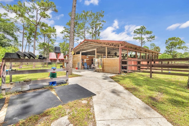 view of community with an outdoor structure