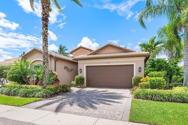 mediterranean / spanish-style house featuring a garage