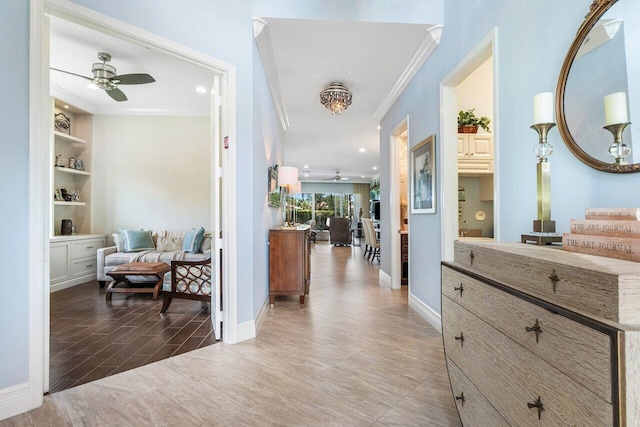 hallway with crown molding and hardwood / wood-style floors