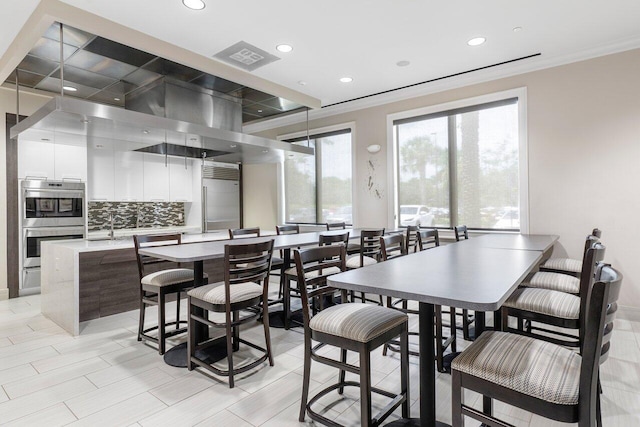 dining room featuring ornamental molding